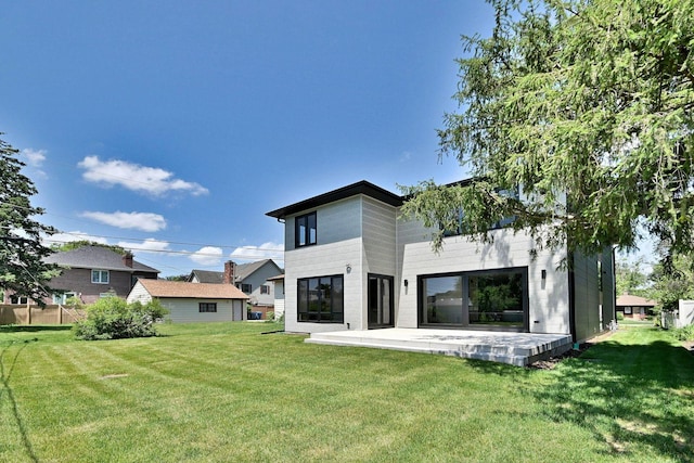 332 W Fremont Ave, Elmhurst, IL 60126 - back of property with a lawn and a patio area