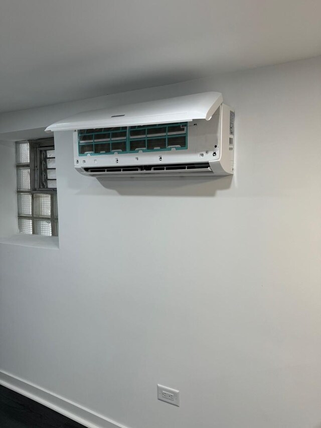 1422 N Latrobe Ave, Chicago, IL 60651 - detailed view of an AC wall unit and baseboards
