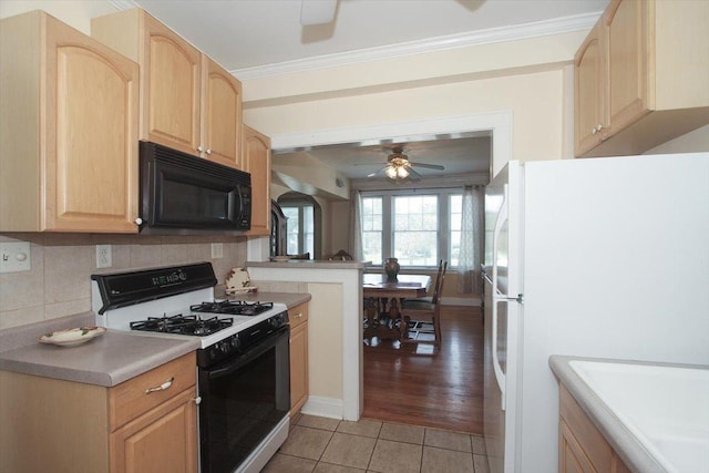43 N Park Ave Unit 1A, Lombard, IL 60148 - kitchen featuring black microwave, gas range, light brown cabinetry, a ceiling fan, and freestanding refrigerator