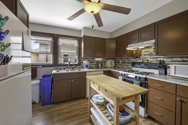 6513 Kane Ave, Hodgkins, IL 60525 - kitchen featuring under cabinet range hood, white appliances, a sink, tasteful backsplash, and a ceiling fan