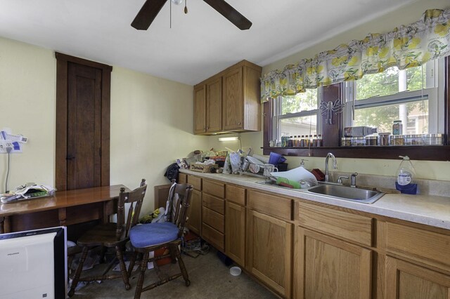 6513 Kane Ave, Hodgkins, IL 60525 - kitchen featuring light countertops, a ceiling fan, a sink, and brown cabinets