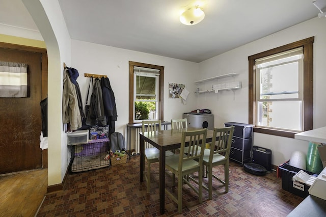 6513 Kane Ave, Hodgkins, IL 60525 - dining area with arched walkways and brick patterned flooring