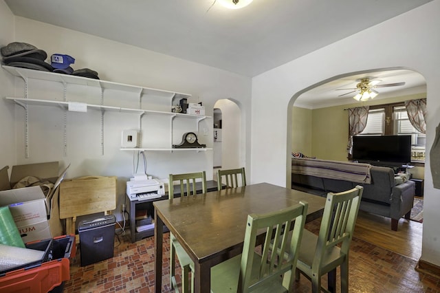 6513 Kane Ave, Hodgkins, IL 60525 - dining room featuring arched walkways, a ceiling fan, brick patterned floors, and ornamental molding