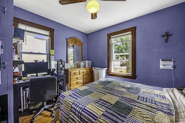 6513 Kane Ave, Hodgkins, IL 60525 - bedroom with wood finished floors, a ceiling fan, and a wall mounted AC