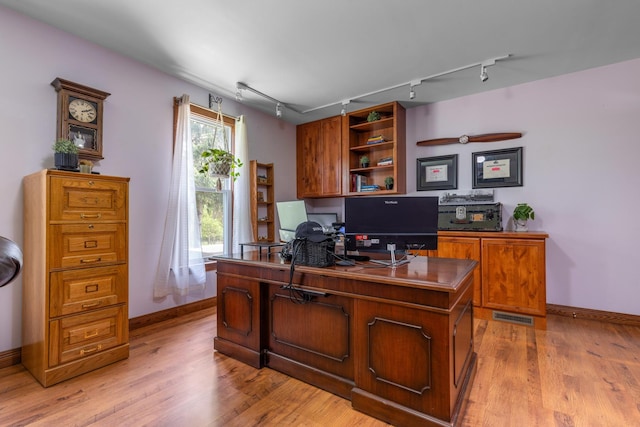 12002 Patterson Rd, Durand, IL 61024 - office area featuring rail lighting and light wood-type flooring