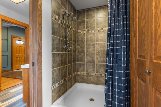 12002 Patterson Rd, Durand, IL 61024 - full bath with tiled shower and wood finished floors