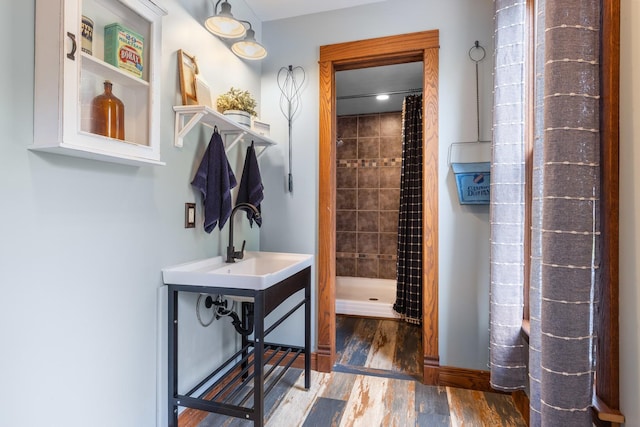 12002 Patterson Rd, Durand, IL 61024 - bathroom with a stall shower and wood finished floors