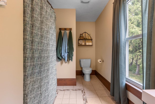 12002 Patterson Rd, Durand, IL 61024 - full bath with tile patterned floors, plenty of natural light, a shower, and inlaid floor details