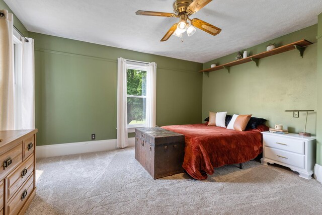 12002 Patterson Rd, Durand, IL 61024 - carpeted bedroom with ceiling fan and baseboards