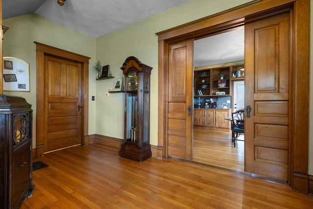 12002 Patterson Rd, Durand, IL 61024 - foyer entrance featuring hardwood / wood-style flooring and baseboards