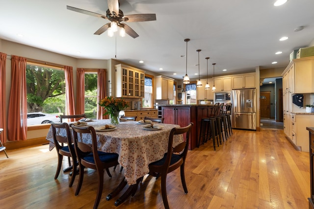 12002 Patterson Rd, Durand, IL 61024 - dining area with light wood-style flooring, a ceiling fan, and recessed lighting