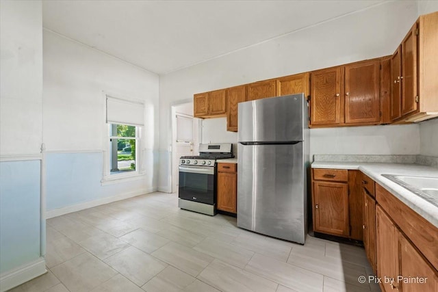 18 Madison St, Algonquin, IL 60102 - kitchen with stainless steel appliances, brown cabinetry, and light countertops