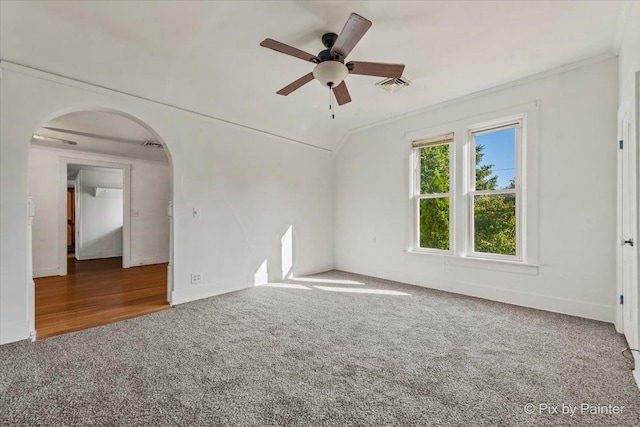 18 Madison St, Algonquin, IL 60102 - spare room featuring carpet floors, ceiling fan, ornamental molding, arched walkways, and vaulted ceiling