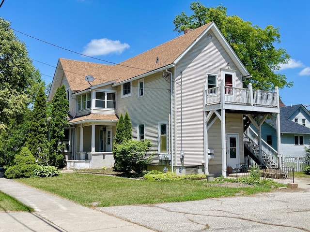 18 Madison St, Algonquin, IL 60102 - view of property exterior with a yard, roof with shingles, and stairway