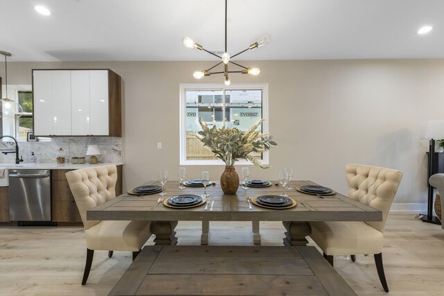 5901 W Erie St, Chicago, IL 60644 - dining room with light wood-type flooring, healthy amount of natural light, a chandelier, recessed lighting, and baseboards