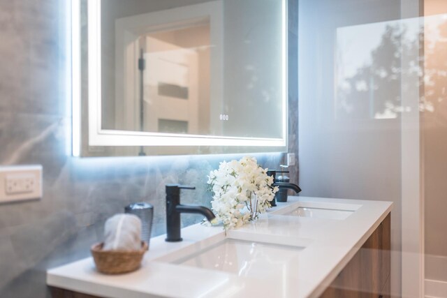 5901 W Erie St, Chicago, IL 60644 - bathroom with double vanity and backsplash