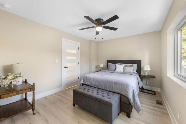 5901 W Erie St, Chicago, IL 60644 - bedroom featuring light wood-style flooring, baseboards, and ceiling fan