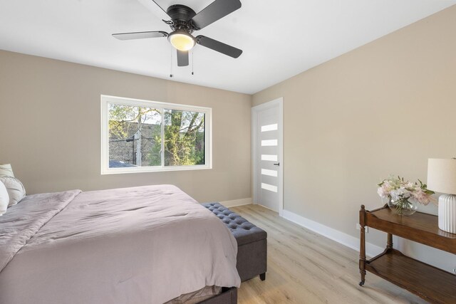 5901 W Erie St, Chicago, IL 60644 - bedroom with light wood finished floors, baseboards, and a ceiling fan
