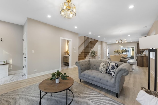 5901 W Erie St, Chicago, IL 60644 - living room with a chandelier, stairs, recessed lighting, and baseboards