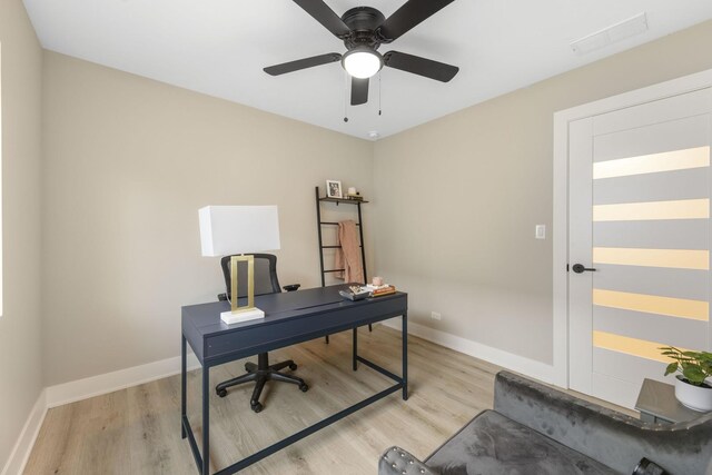 5901 W Erie St, Chicago, IL 60644 - home office featuring light wood finished floors, baseboards, and a ceiling fan