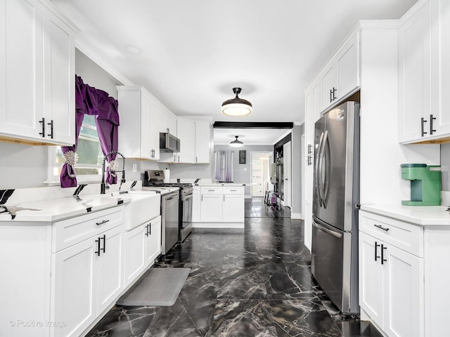 1246 Marengo Ave, Forest Park, IL 60130 - kitchen with appliances with stainless steel finishes, white cabinets, light countertops, and crown molding