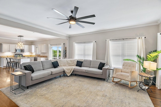 1S215 S Hyde Park, Geneva, IL 60134 - living room featuring wood finished floors, a ceiling fan, and crown molding