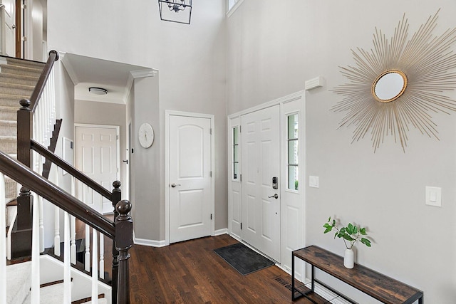 1S215 S Hyde Park, Geneva, IL 60134 - foyer with stairway, dark wood-type flooring, and a high ceiling