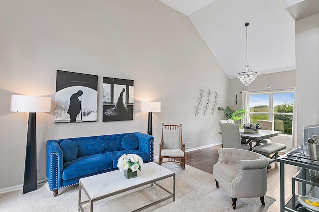 1S215 S Hyde Park, Geneva, IL 60134 - living room featuring high vaulted ceiling, a chandelier, and wood finished floors