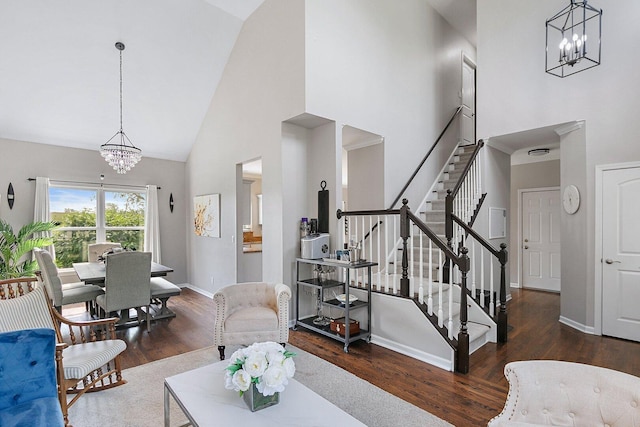 1S215 S Hyde Park, Geneva, IL 60134 - living area featuring a chandelier, high vaulted ceiling, stairway, and wood finished floors