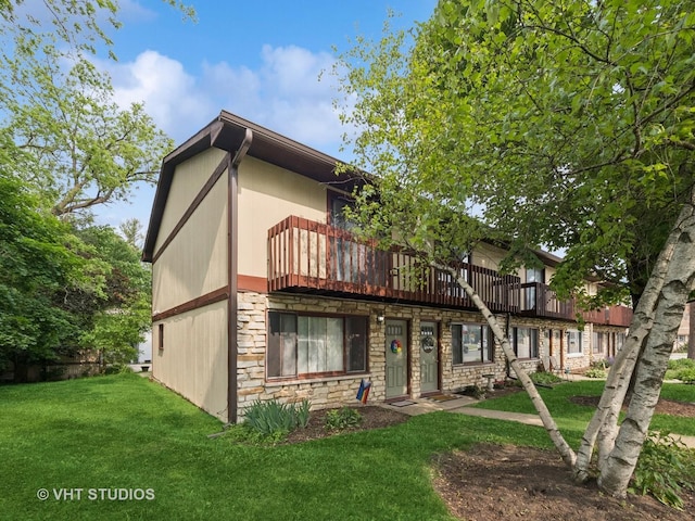 422 Lincoln Ave Unit A, Fox River Grove, IL 60021 - view of property featuring stone siding and a front lawn