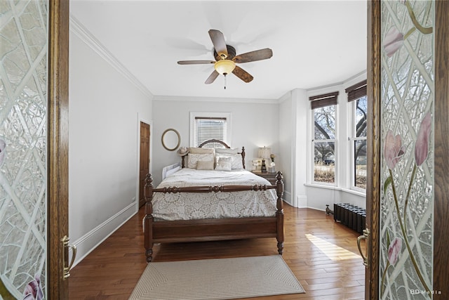 5213 Fairview Ave, Downers Grove, IL 60515 - bedroom with radiator heating unit, multiple windows, hardwood / wood-style floors, and ornamental molding