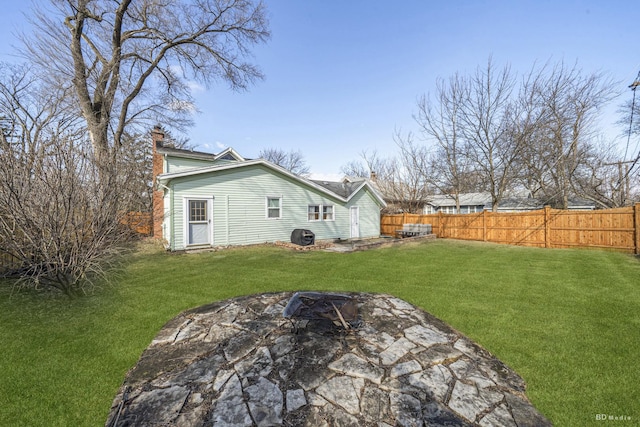 5213 Fairview Ave, Downers Grove, IL 60515 - rear view of house featuring a fire pit, a chimney, and a patio