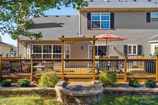 439 Camden Cir, Oswego, IL 60543 - back of property with a shingled roof and a wooden deck