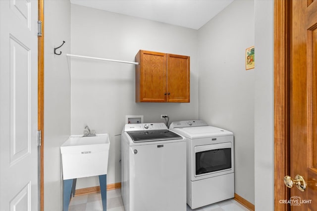439 Camden Cir, Oswego, IL 60543 - laundry area featuring cabinet space and washer and clothes dryer