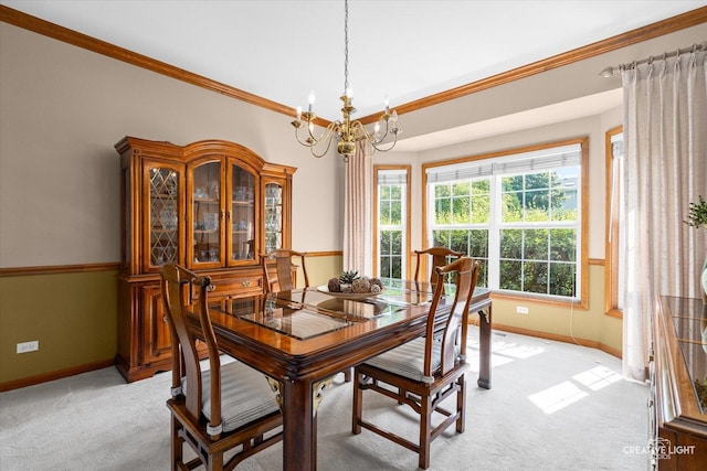 439 Camden Cir, Oswego, IL 60543 - dining room featuring light colored carpet, a chandelier, and crown molding