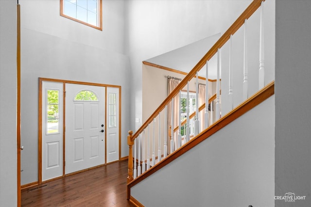 439 Camden Cir, Oswego, IL 60543 - foyer featuring healthy amount of natural light, wood finished floors, stairs, and a high ceiling
