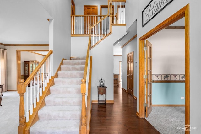 439 Camden Cir, Oswego, IL 60543 - stairway with wood finished floors and a high ceiling