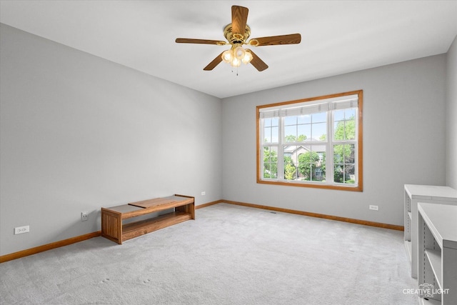 439 Camden Cir, Oswego, IL 60543 - unfurnished bedroom featuring light colored carpet and ceiling fan