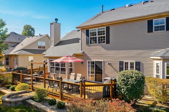 439 Camden Cir, Oswego, IL 60543 - back of house featuring a deck, a chimney, a shingled roof, and an outdoor hangout area