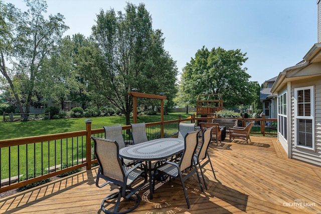 439 Camden Cir, Oswego, IL 60543 - wooden deck featuring outdoor dining space, a playground, and a fenced backyard