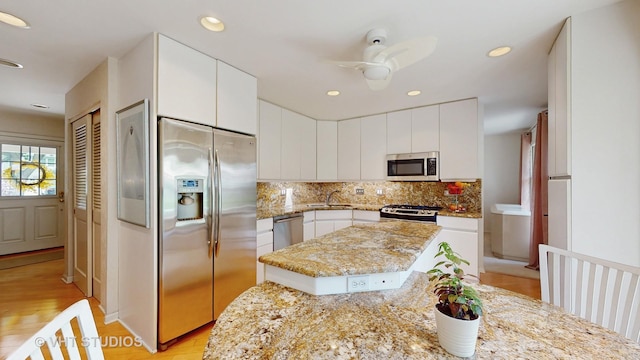 3026 N Stratford Rd, Arlington Heights, IL 60004 - kitchen featuring appliances with stainless steel finishes, tasteful backsplash, white cabinets, and recessed lighting