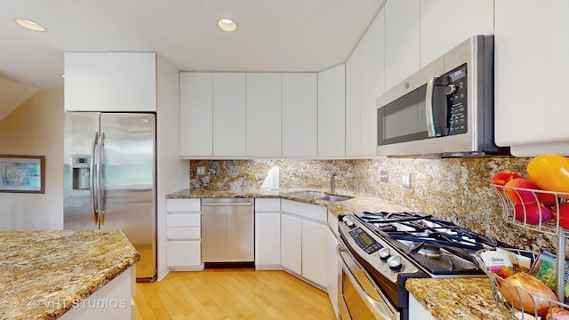 3026 N Stratford Rd, Arlington Heights, IL 60004 - kitchen with appliances with stainless steel finishes, light wood-style flooring, white cabinets, light stone counters, and recessed lighting