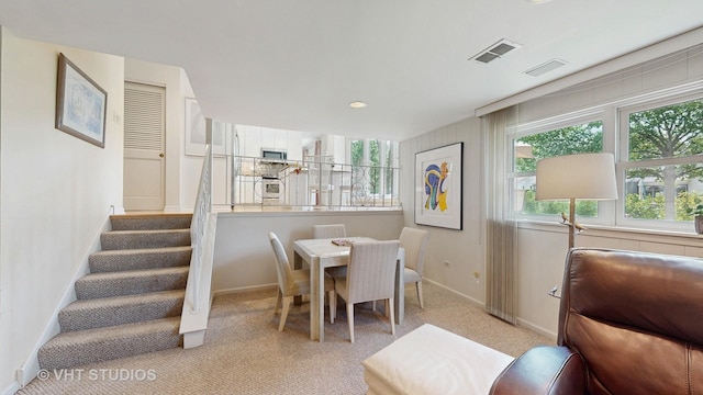 3026 N Stratford Rd, Arlington Heights, IL 60004 - dining space featuring stairway, carpet floors, and recessed lighting