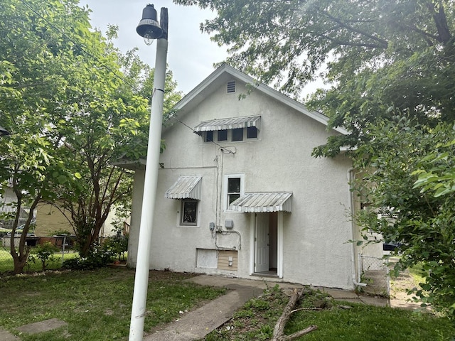 153 N Entrance Ave, Kankakee, IL 60901 - rear view of property featuring stucco siding