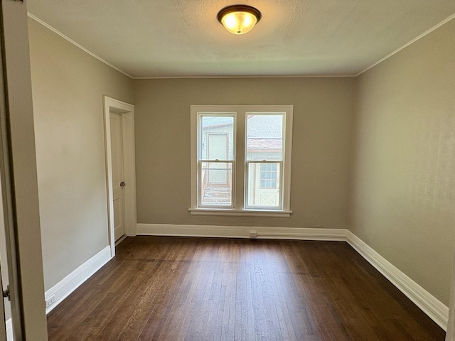153 N Entrance Ave, Kankakee, IL 60901 - unfurnished room with dark wood finished floors and ornamental molding
