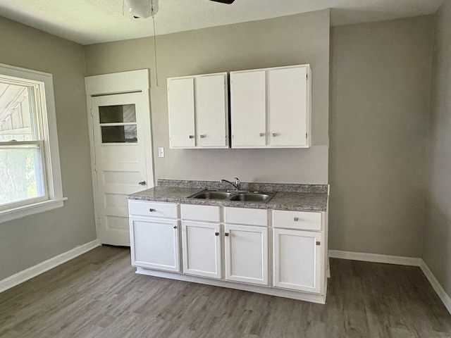 153 N Entrance Ave, Kankakee, IL 60901 - kitchen with white cabinets, light wood-style floors, and a ceiling fan
