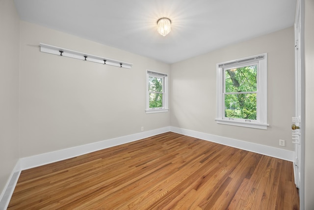4416 Seeley Ave, Downers Grove, IL 60515 - empty room with baseboards and wood finished floors