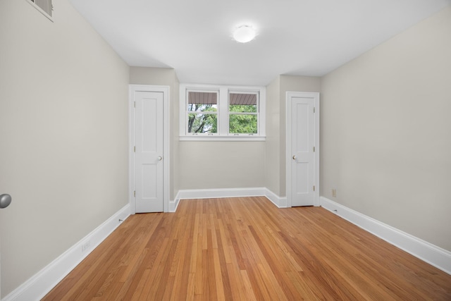 4416 Seeley Ave, Downers Grove, IL 60515 - spare room featuring light wood-style flooring and baseboards