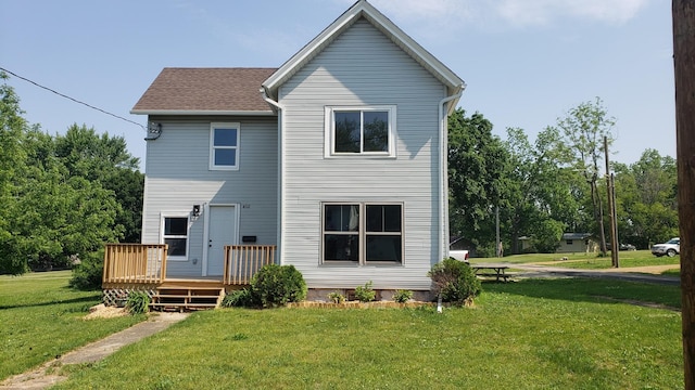 402 W Fulton St, Polo, IL 61064 - rear view of property with a deck and a yard