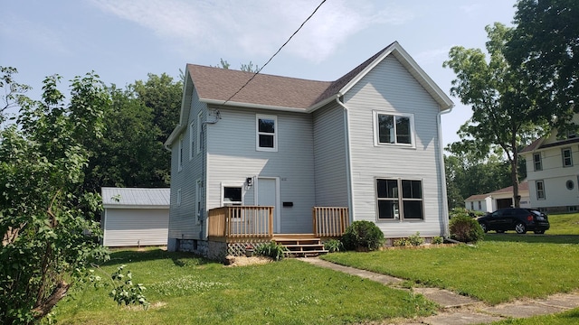 402 W Fulton St, Polo, IL 61064 - back of house featuring a wooden deck and a lawn